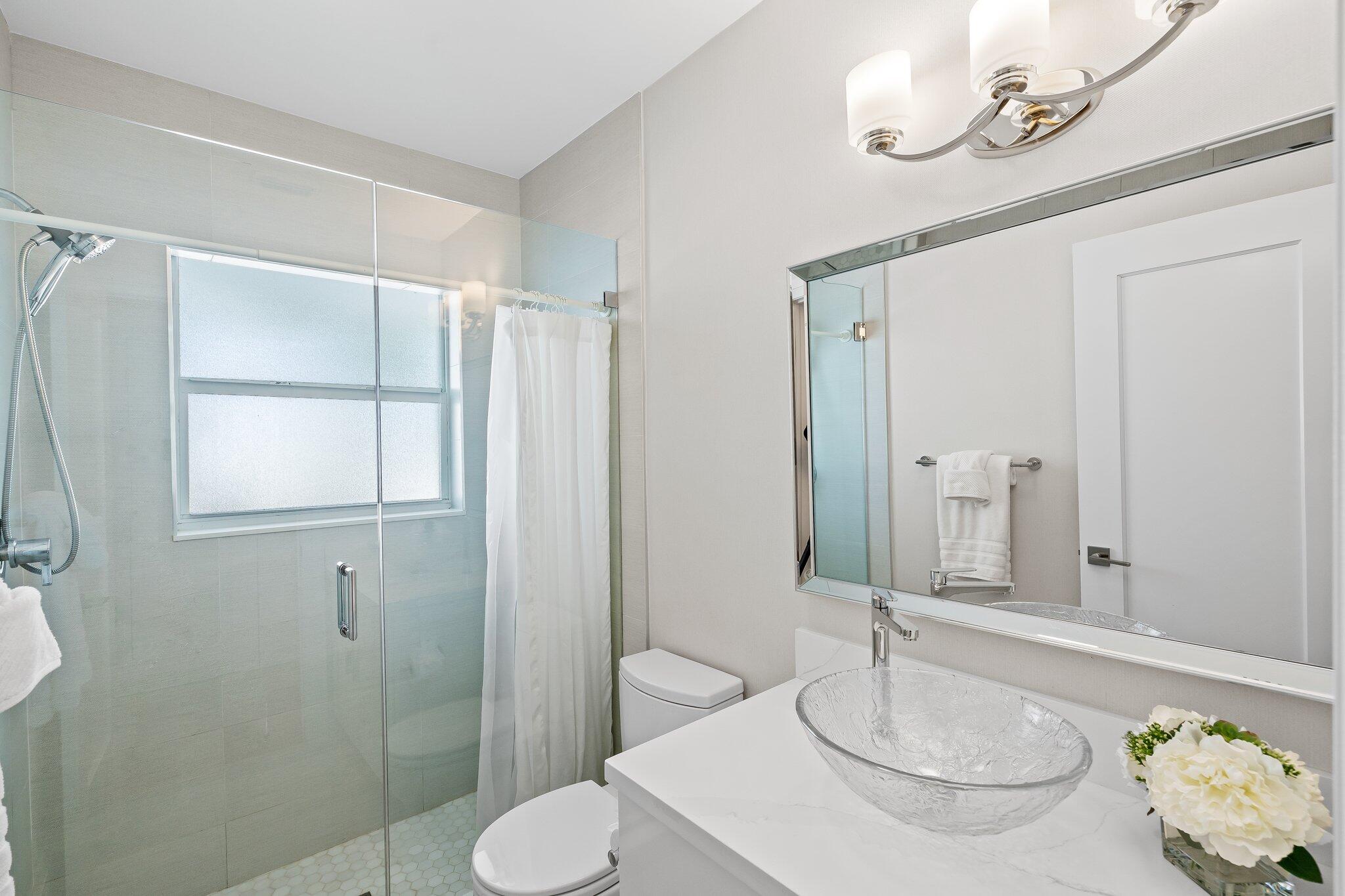 1090 Cypress Way Boca Raton, FL 33486 - Photo 25 of 40 a bathroom with a sink toilet and shower