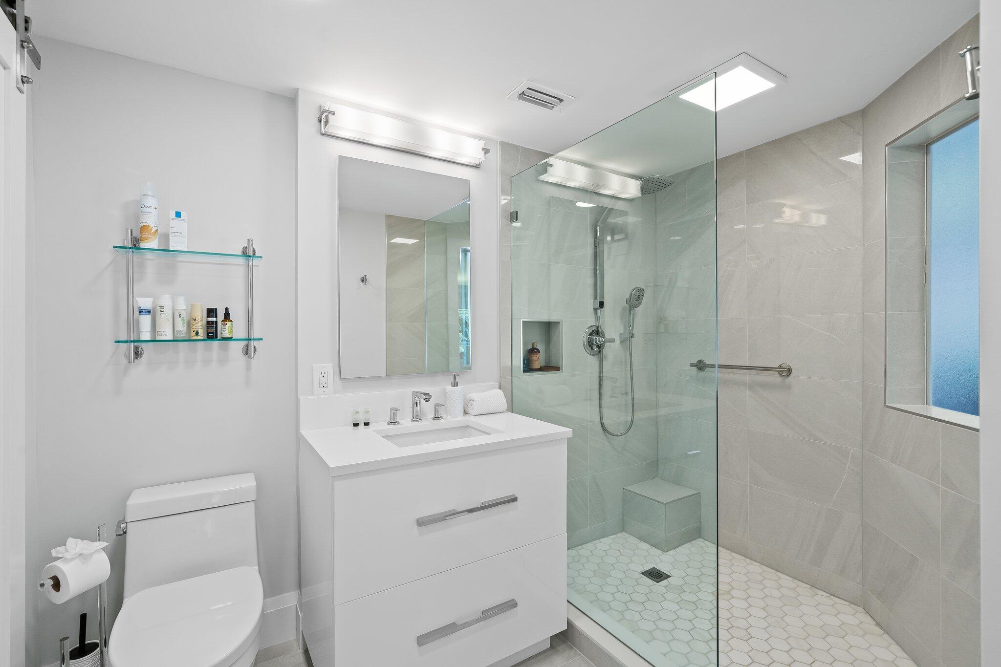 1090 Cypress Way Boca Raton, FL 33486 - Photo 26 of 40 a bathroom with a shower sink mirror and toilet