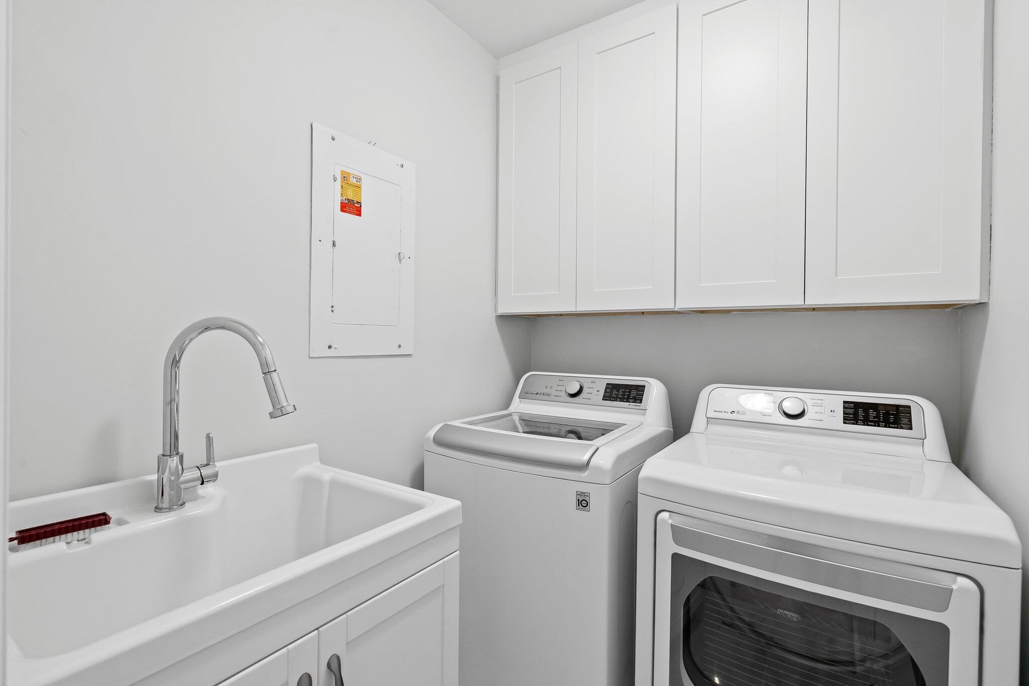 1090 Cypress Way Boca Raton, FL 33486 - Photo 28 of 40 a view of storage and utility room with washer and dryer