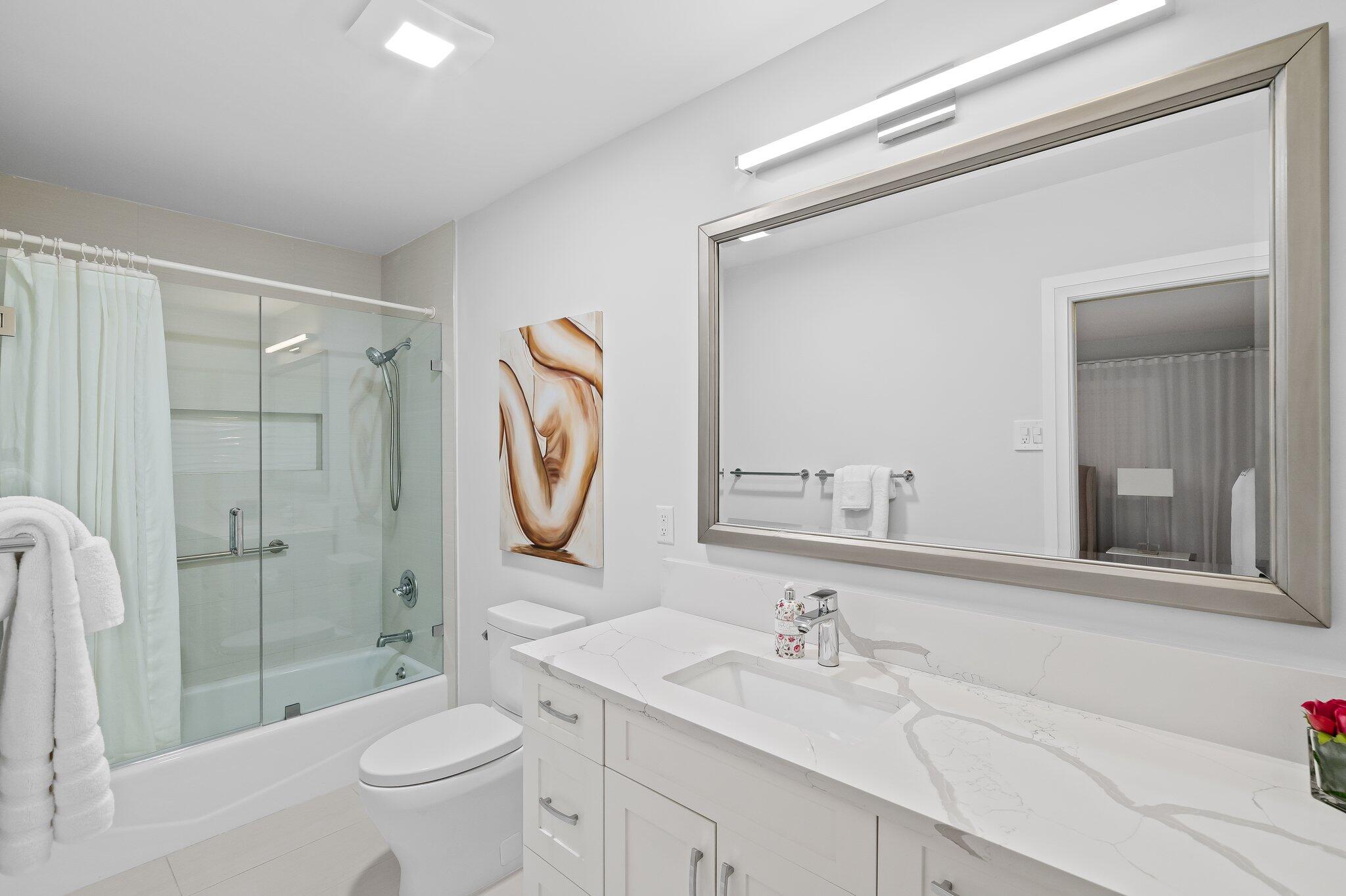 1090 Cypress Way Boca Raton, FL 33486 - Photo 29 of 40 a bathroom with a sink a toilet and shower