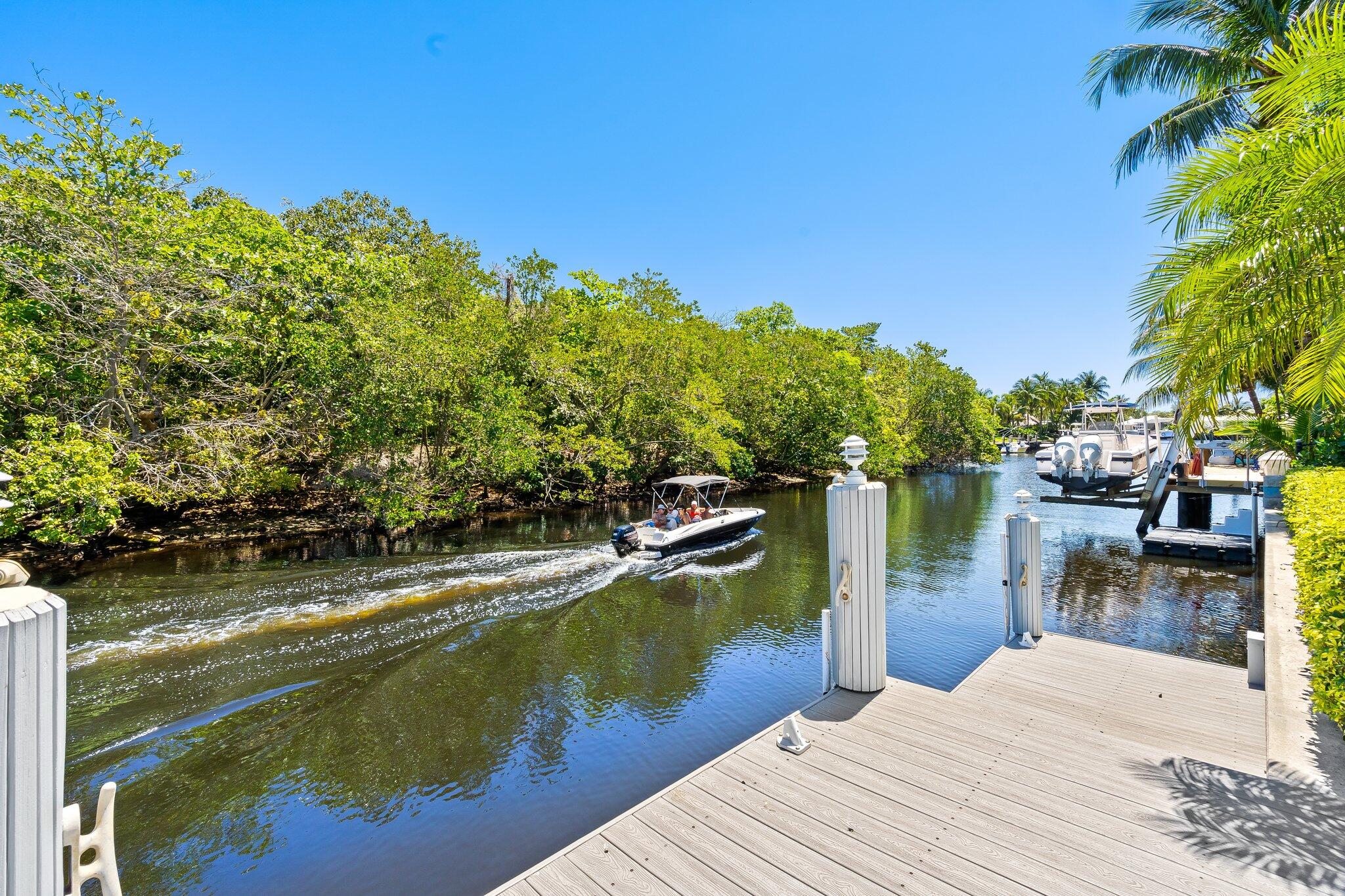 1090 Cypress Way Boca Raton, FL 33486 - Photo 34 of 40 a view of a lake with houses