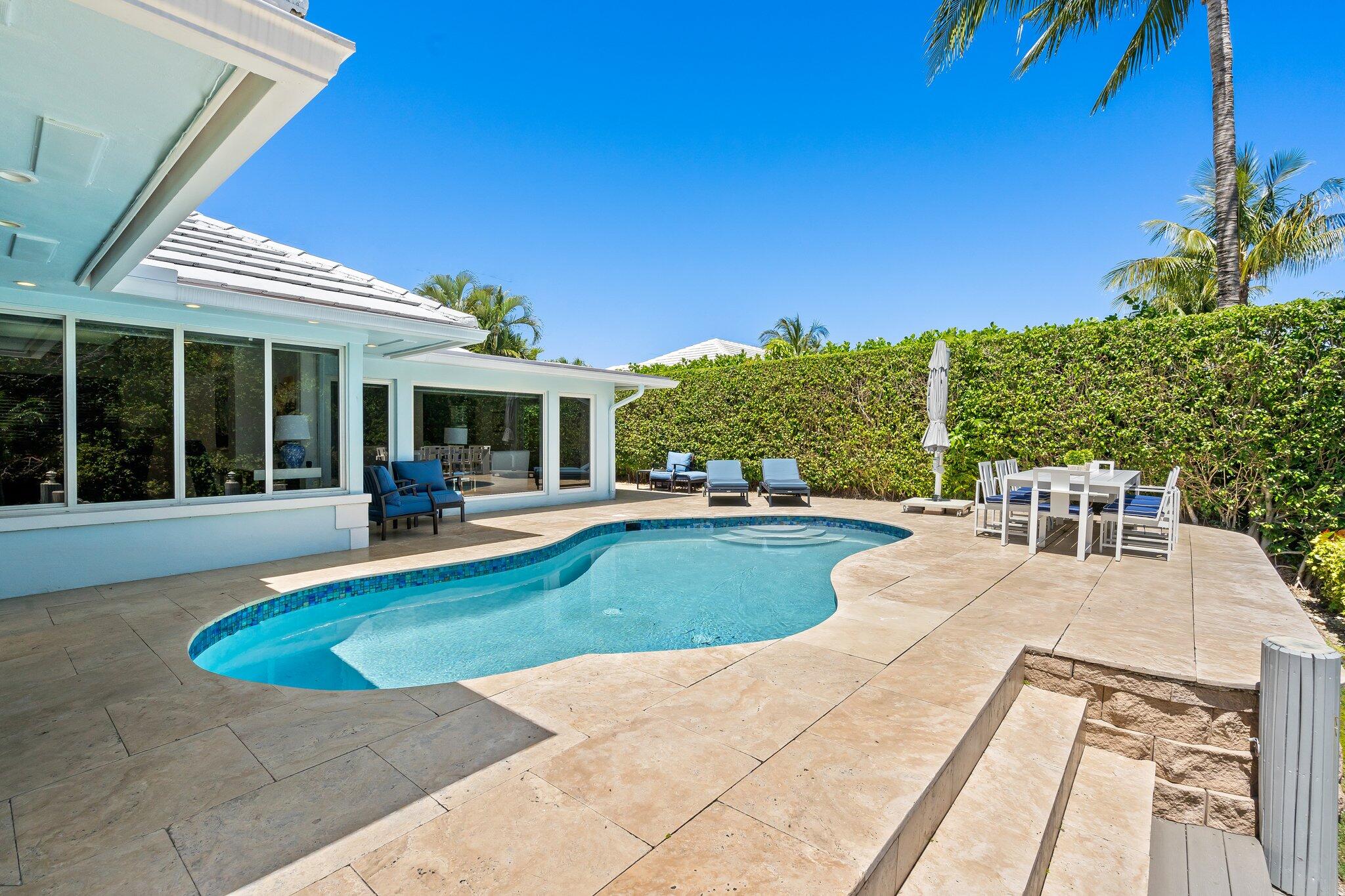 1090 Cypress Way Boca Raton, FL 33486 - Photo 36 of 40 a view of a house with swimming pool and sitting area