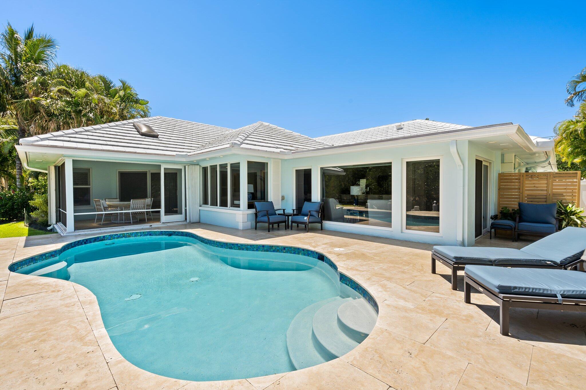 1090 Cypress Way Boca Raton, FL 33486 - Photo 38 of 40 a view of a house with swimming pool and porch