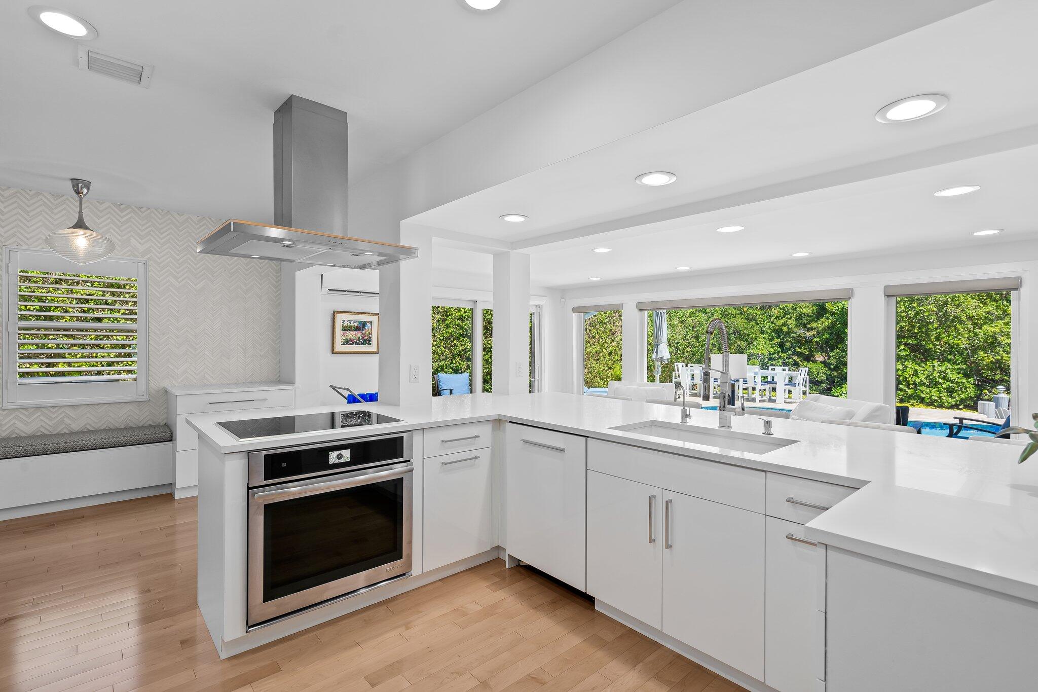 1090 Cypress Way Boca Raton, FL 33486 - Photo 5 of 40 a kitchen with a stove sink and microwave