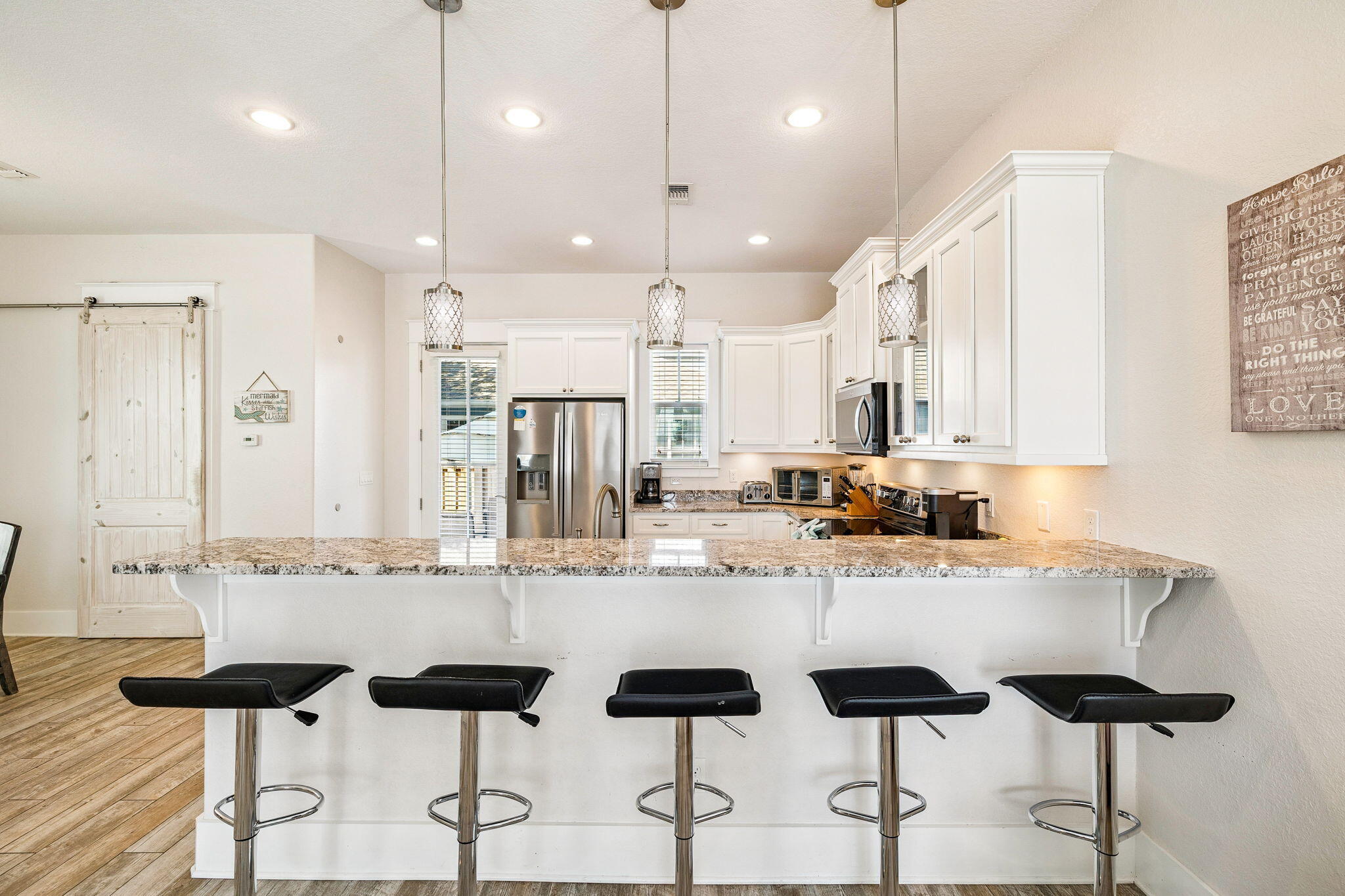 32 Moonlit Shores Lane Santa Rosa Beach, FL 32459 - Photo 11 of 48 a kitchen with granite countertop cabinets and refrigerator