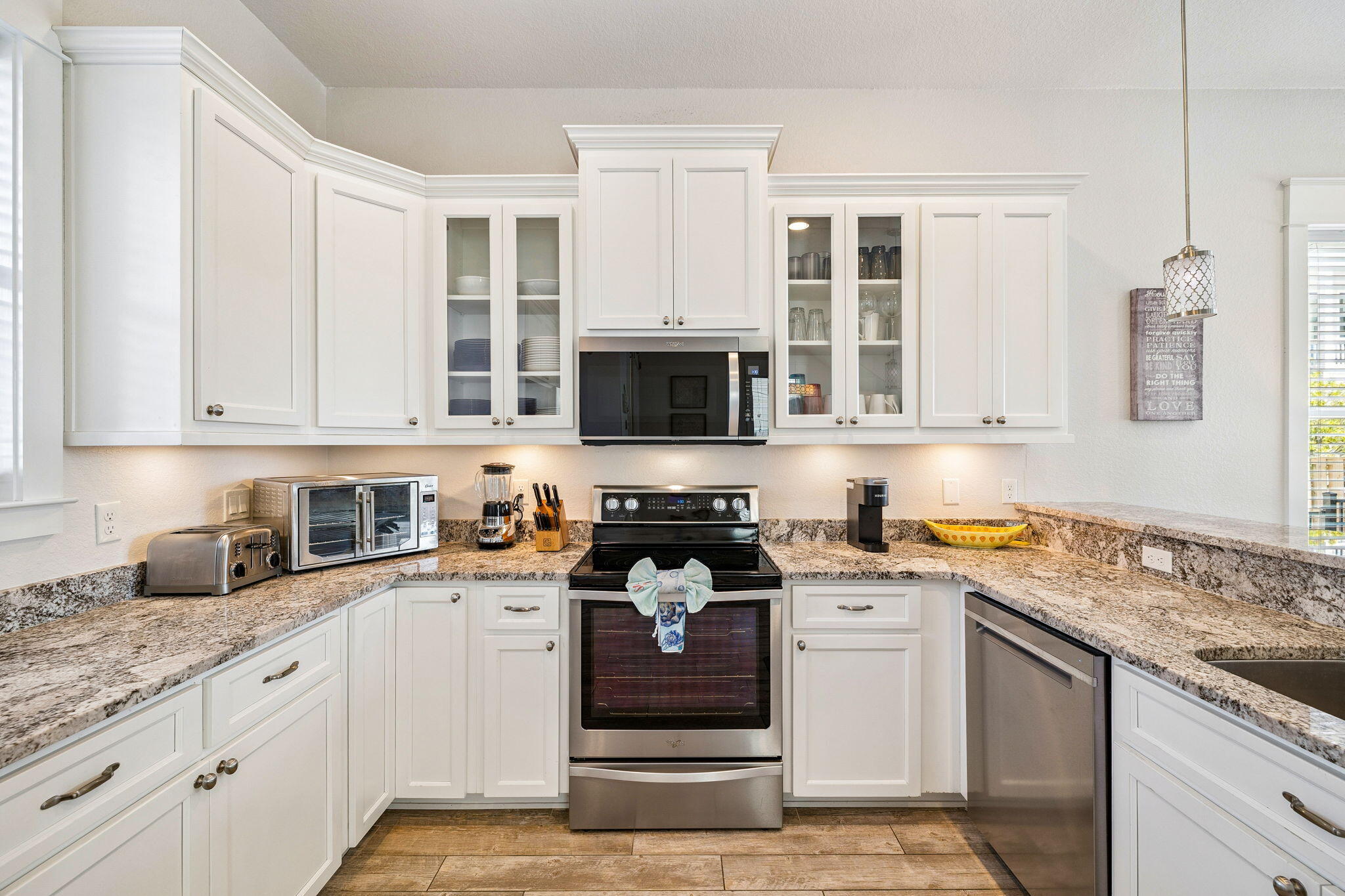 32 Moonlit Shores Lane Santa Rosa Beach, FL 32459 - Photo 13 of 48 a kitchen with granite countertop white cabinets and stainless steel appliances