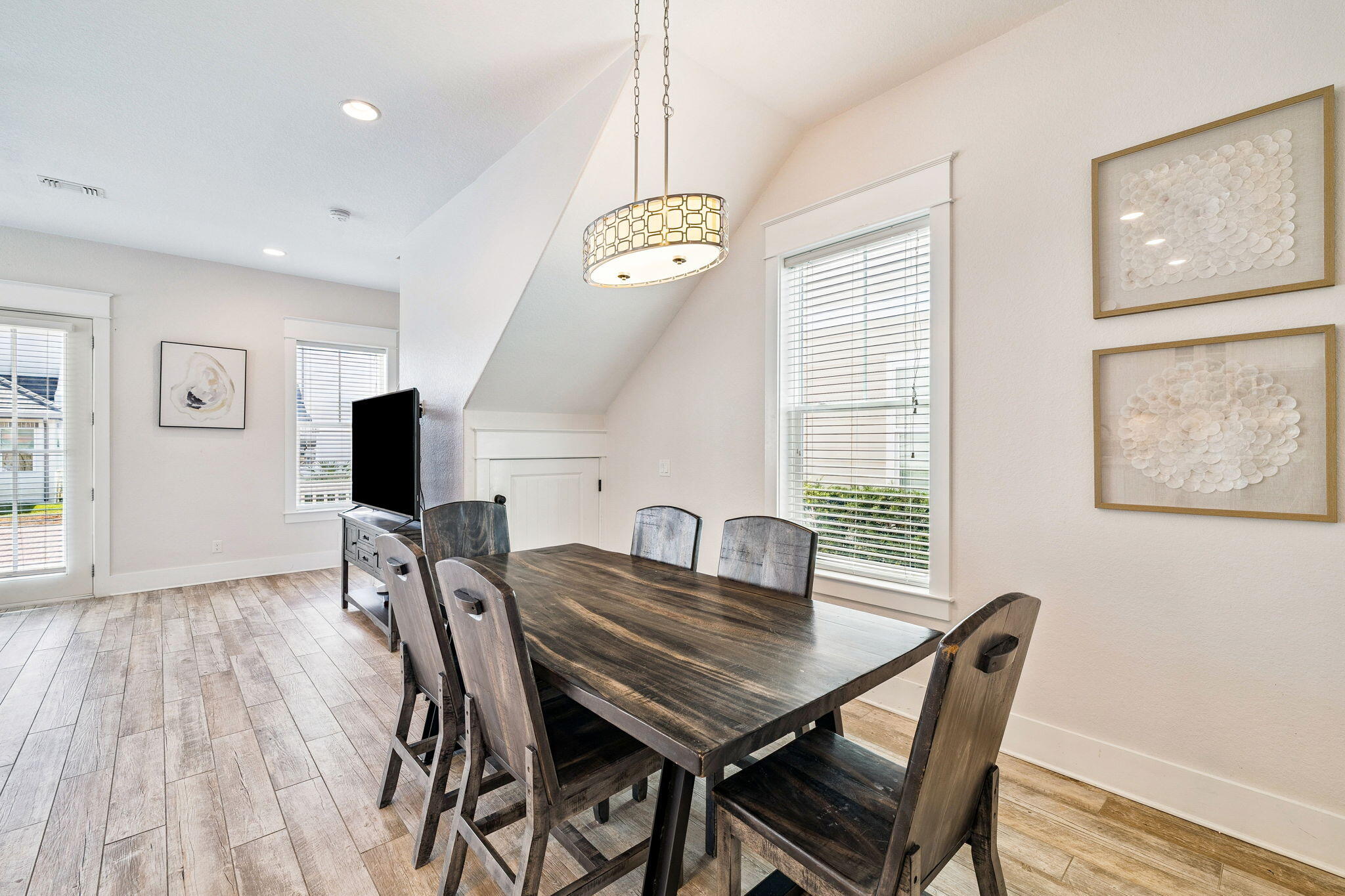 32 Moonlit Shores Lane Santa Rosa Beach, FL 32459 - Photo 16 of 48 a view of a dining room with furniture and wooden floor