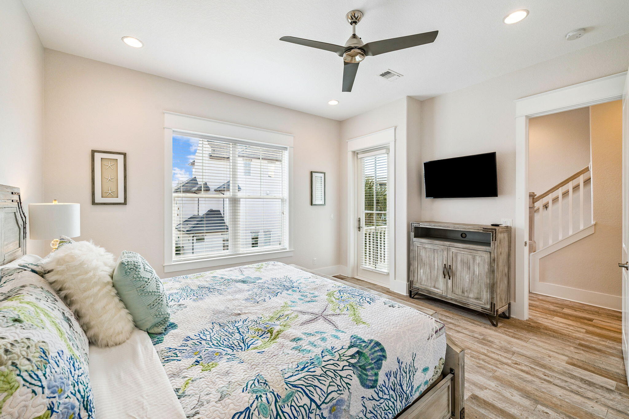 32 Moonlit Shores Lane Santa Rosa Beach, FL 32459 - Photo 19 of 48 a bedroom with a bed flat screen tv and a window
