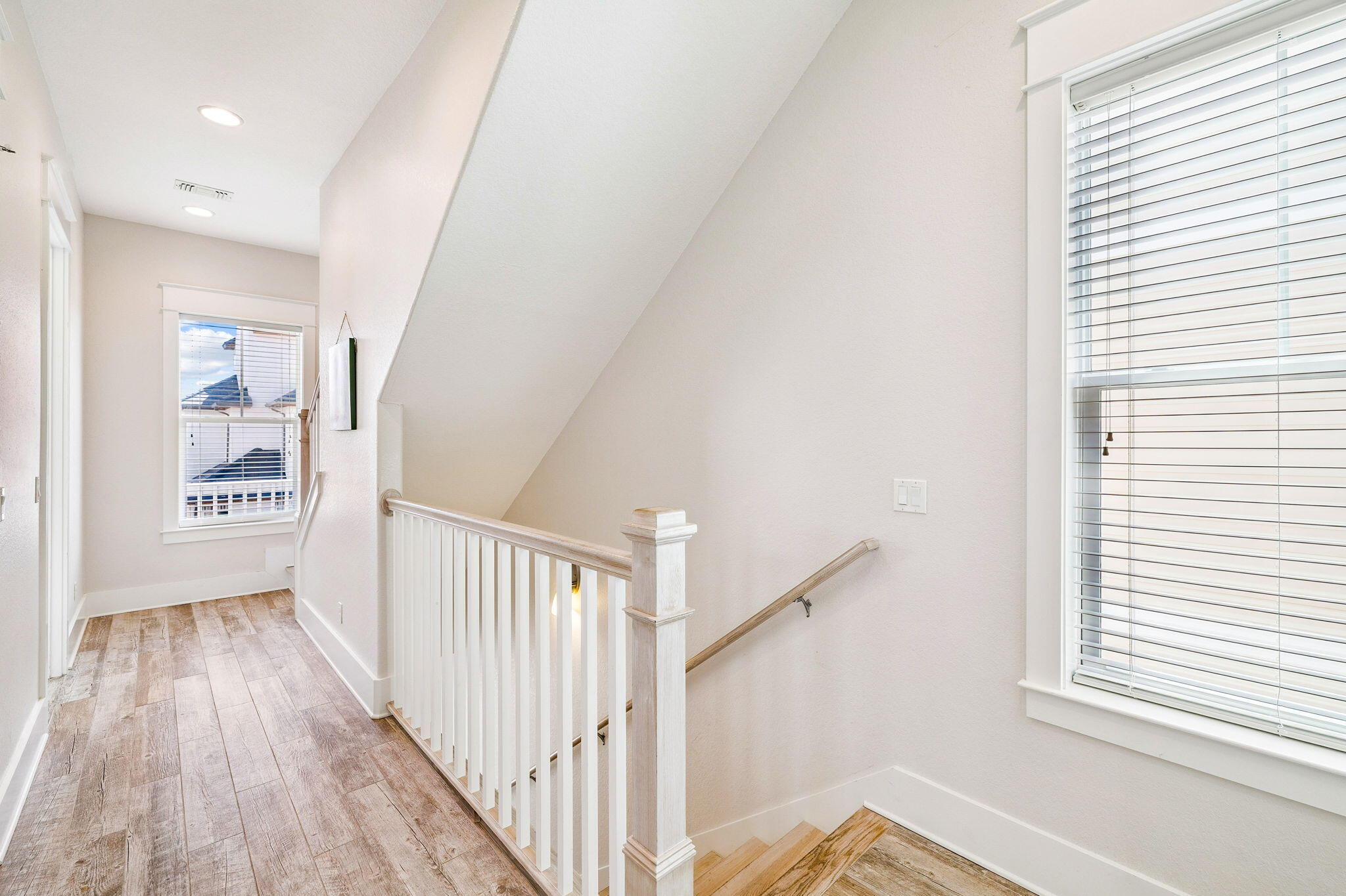 32 Moonlit Shores Lane Santa Rosa Beach, FL 32459 - Photo 25 of 48 a view of a hallway view with wooden floor and staircase