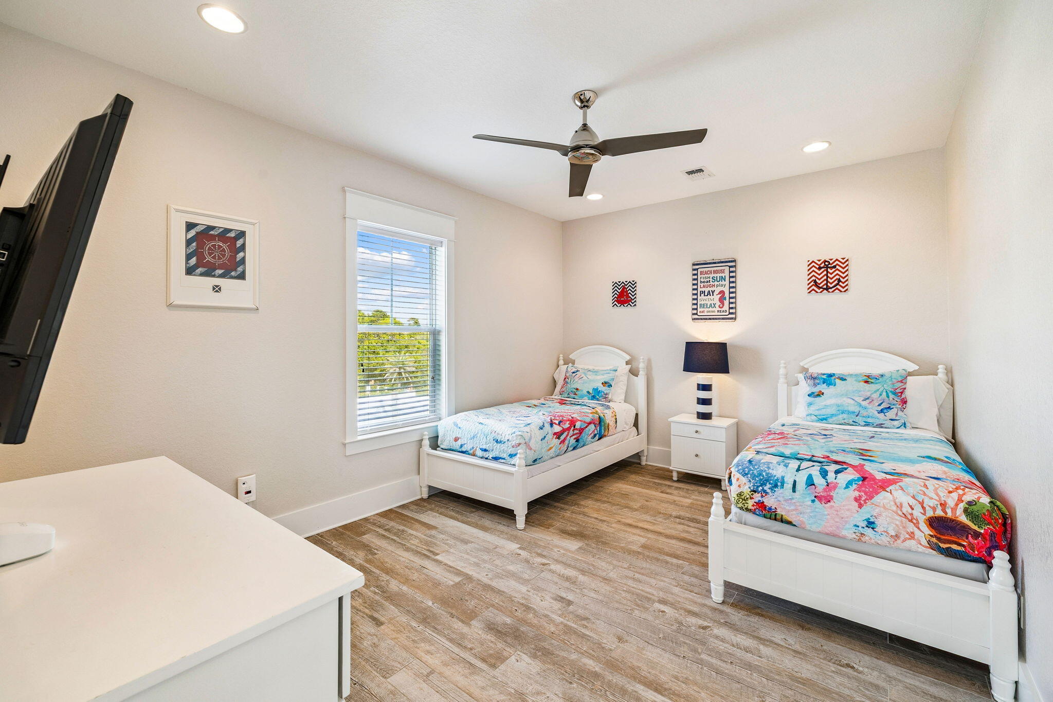 32 Moonlit Shores Lane Santa Rosa Beach, FL 32459 - Photo 27 of 48 a bedroom with a bed and a wooden floor