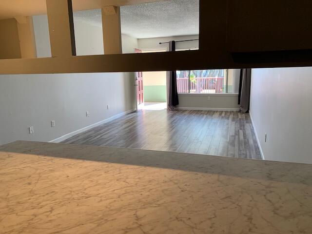 210 Pelham Road, Unit B220 Fort Walton Beach, FL 32547 - Photo 6 of 11 view from kitchen to living area