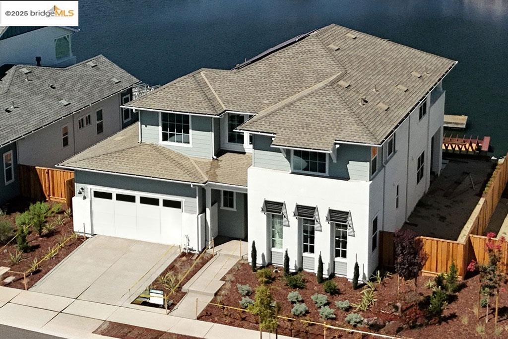 667 Point Place Bethel Island, CA 94511 - Photo 1 of 27 a front view of a house with a garage