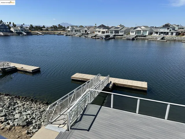 a balcony with a table and chairs