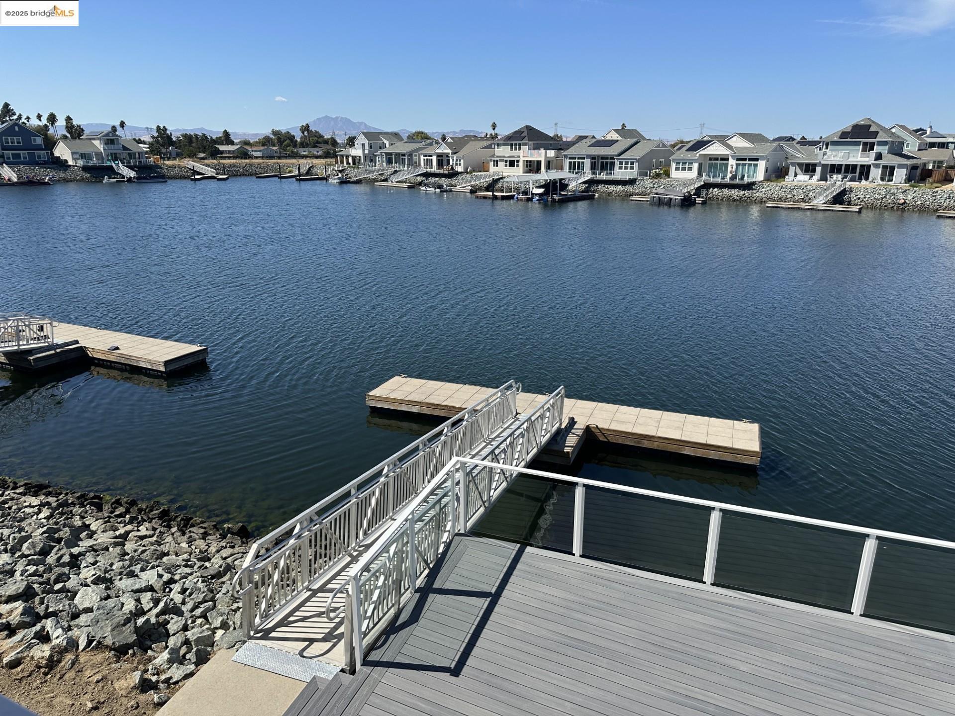 667 Point Place Bethel Island, CA 94511 - Photo 21 of 27 a balcony with a table and chairs