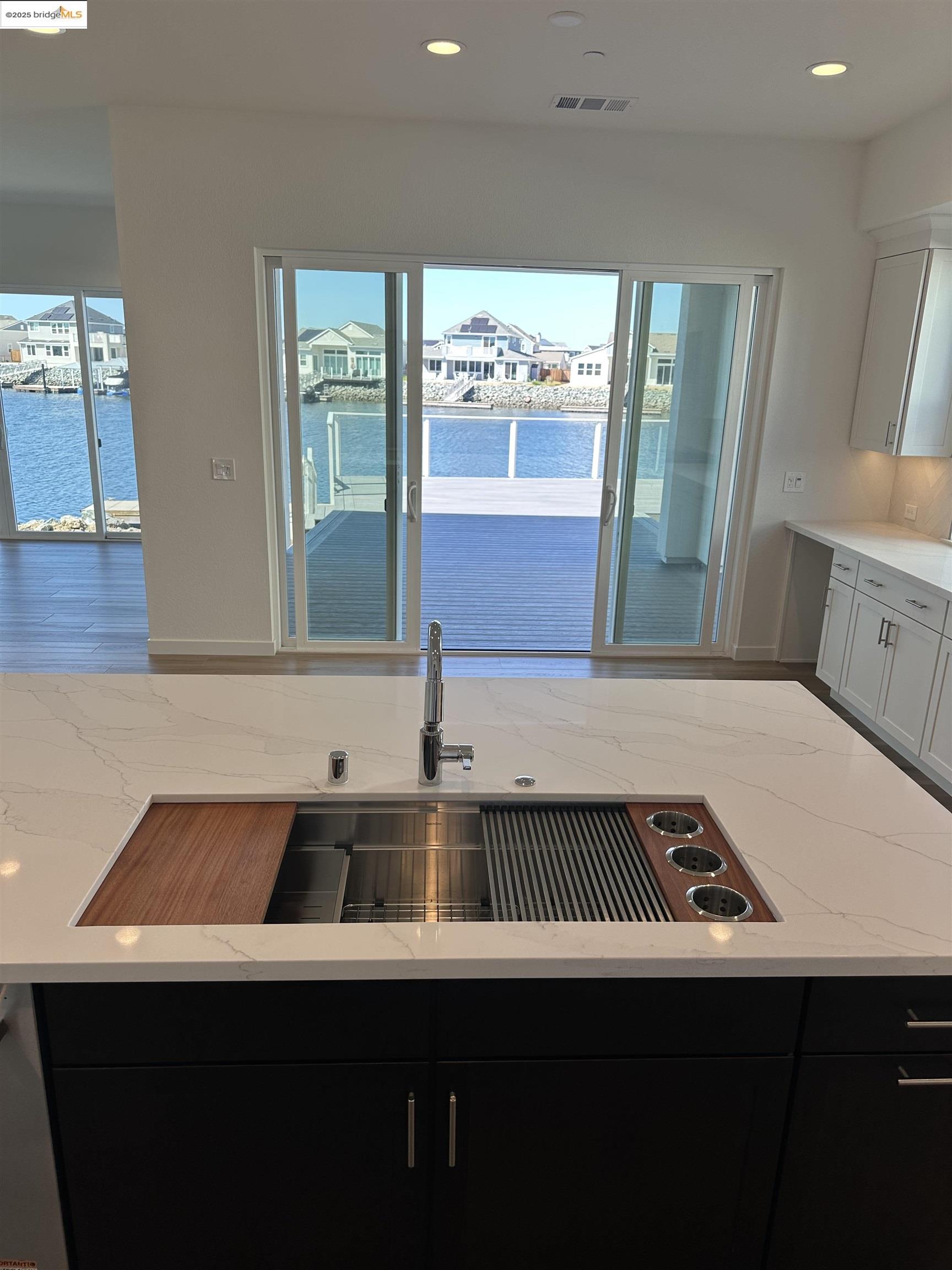 667 Point Place Bethel Island, CA 94511 - Photo 9 of 27 a kitchen with a sink and a stove top oven