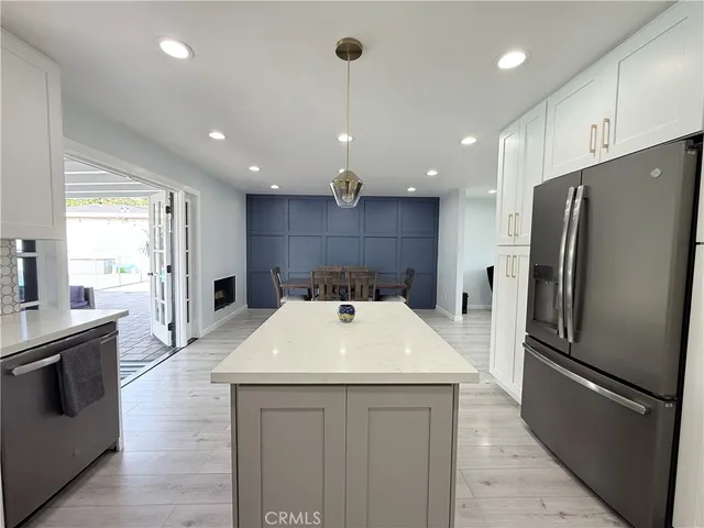 a kitchen with a refrigerator a sink and dishwasher