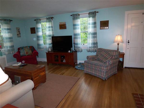2-4 Howland Road Freetown, MA 02702 - Photo 5 of 27 a living room with furniture and a flat screen tv