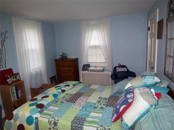 2-4 Howland Road Freetown, MA 02702 - Photo 8 of 27 a bedroom with a bed and a window