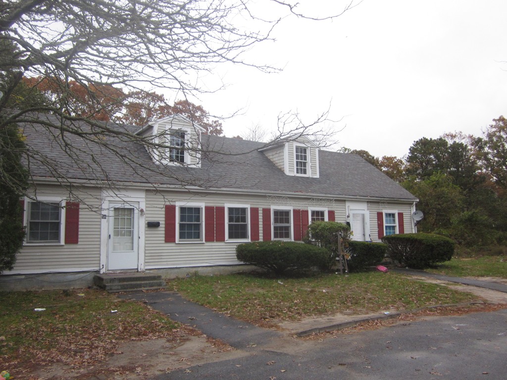 54 Fresh Holes Road Barnstable, MA 02601 - Photo 1 of 1 a front view of a house with a yard