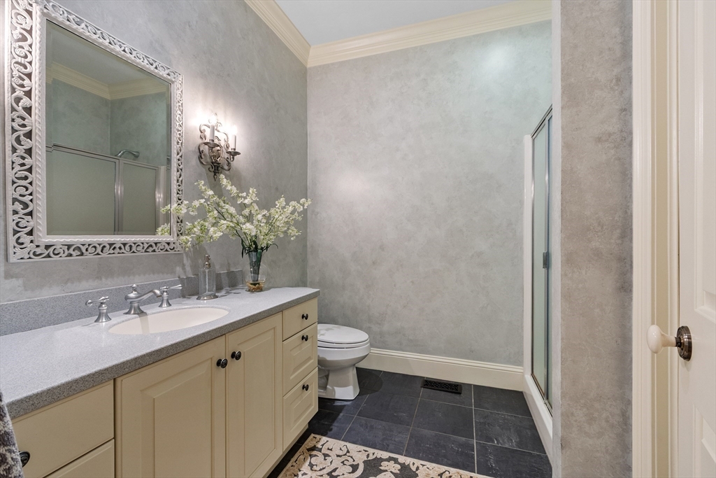 98 Fox Run Road Bolton, MA 01740 - Photo 19 of 42 a bathroom with a sink a toilet a shower and a mirror