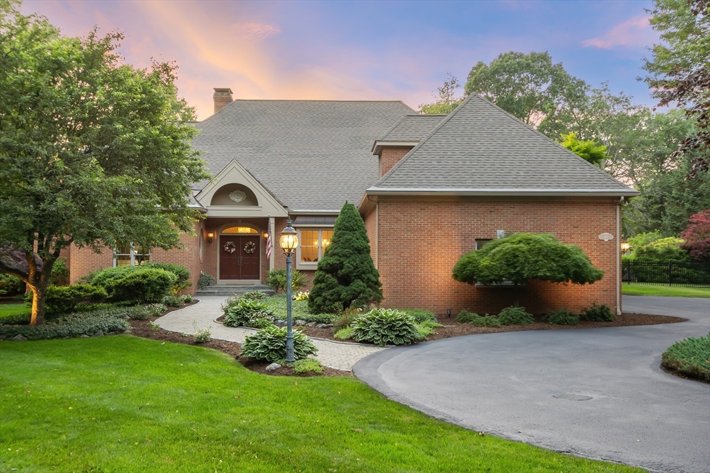 98 Fox Run Road Bolton, MA 01740 - Photo 2 of 42 a front view of a house with a yard and potted plants