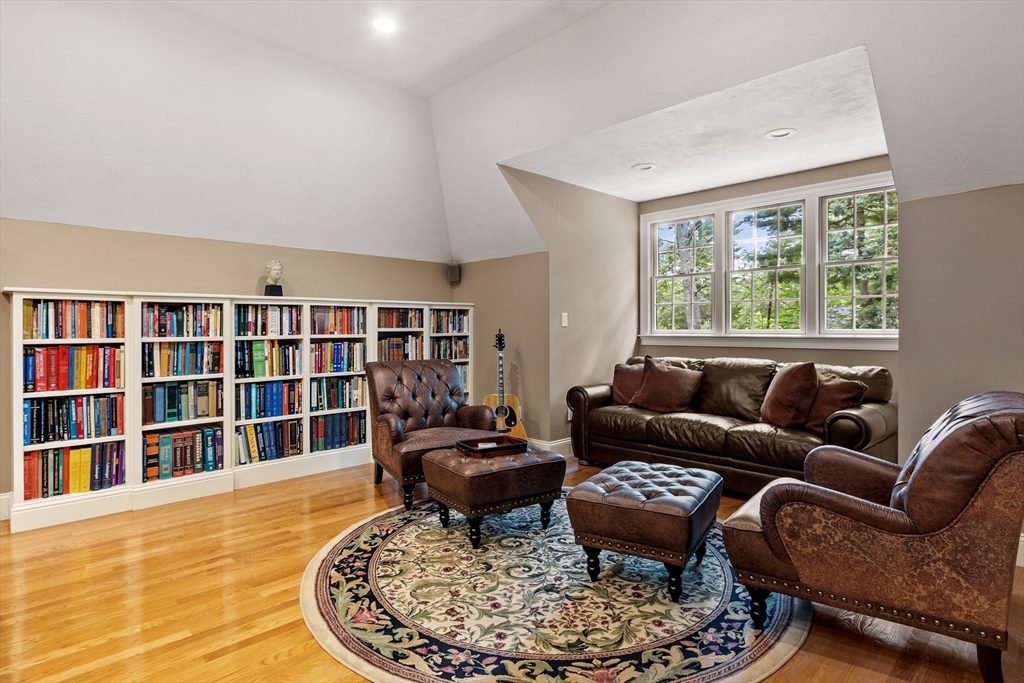 98 Fox Run Road Bolton, MA 01740 - Photo 26 of 42 a living room with furniture and a book shelf