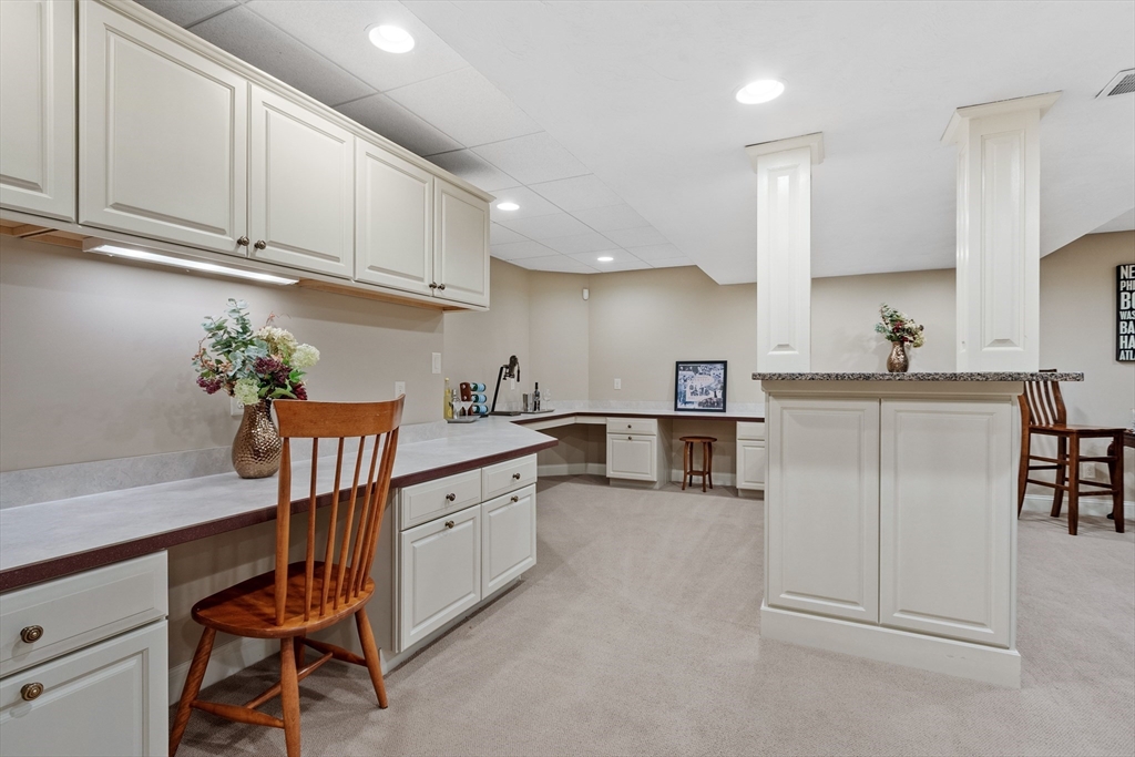 98 Fox Run Road Bolton, MA 01740 - Photo 29 of 42 a kitchen with white cabinets and sink