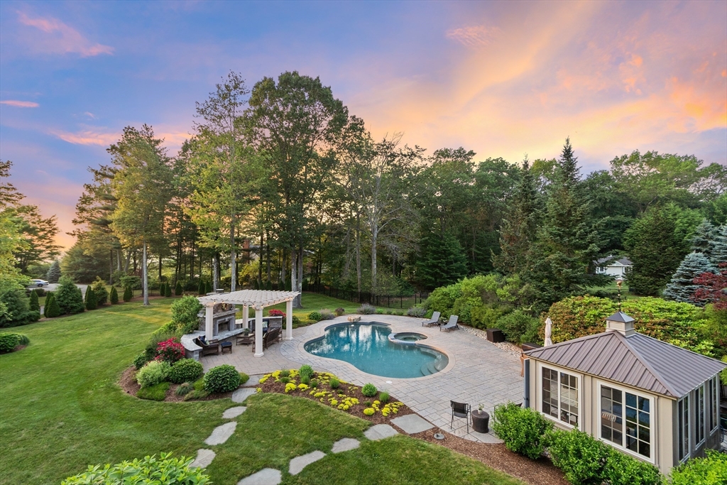 98 Fox Run Road Bolton, MA 01740 - Photo 3 of 42 a view of a swimming pool and lounge chairs in back yard