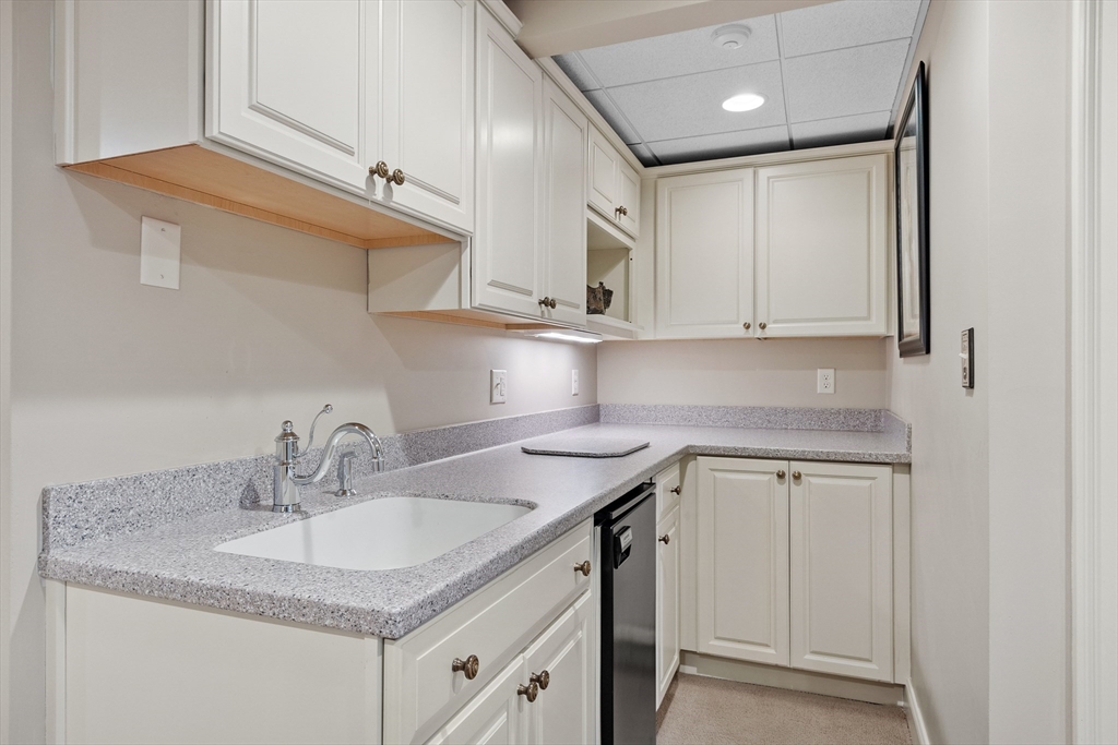 98 Fox Run Road Bolton, MA 01740 - Photo 31 of 42 a kitchen with stainless steel appliances granite countertop a sink and cabinets