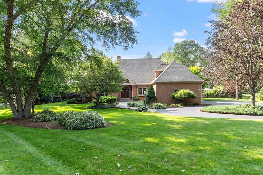98 Fox Run Road Bolton, MA 01740 - Photo 34 of 42 a front view of a house with a yard and trees