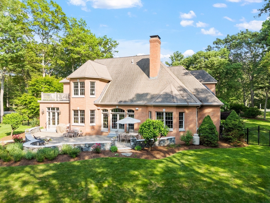 98 Fox Run Road Bolton, MA 01740 - Photo 41 of 42 a front view of a house with a yard and potted plants
