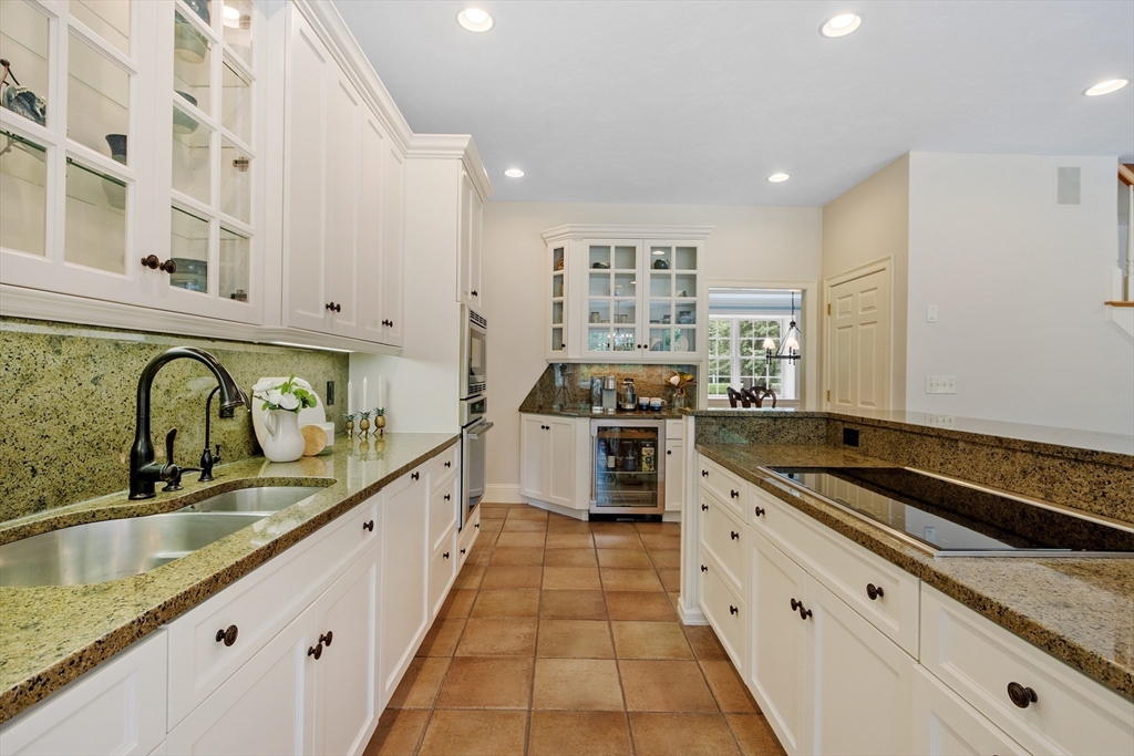 98 Fox Run Road Bolton, MA 01740 - Photo 5 of 42 a kitchen with stainless steel appliances granite countertop a sink and stove