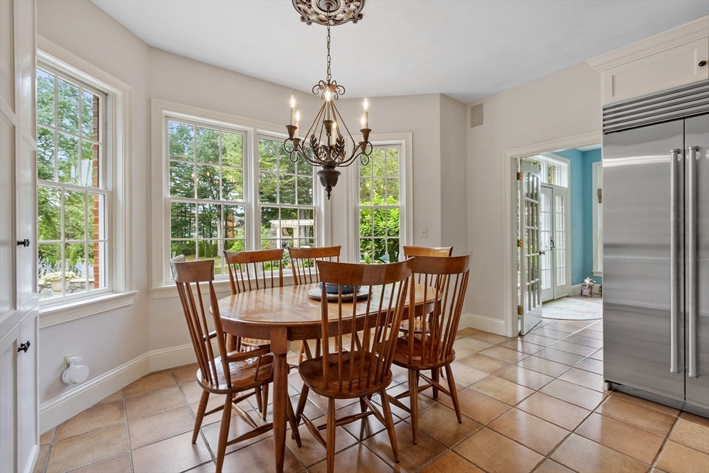 98 Fox Run Road Bolton, MA 01740 - Photo 9 of 42 a view of a dining room with furniture window and outside view