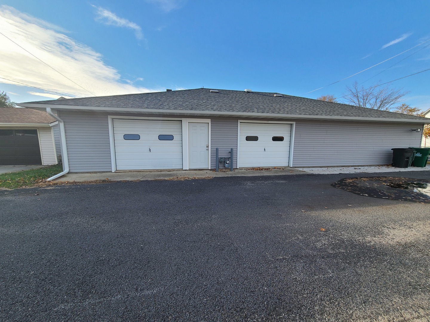 116 West South Street Franklin Grove, IL 61031 - Photo 2 of 21 a view of garage and yard