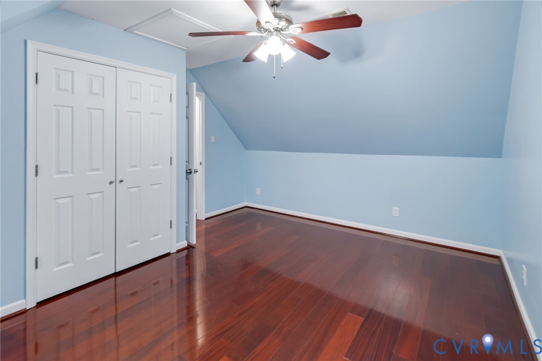 2869 Newville Road Disputanta, VA 23842 - Photo 19 of 26 Wood-finish flooring, white paneled bifold closet