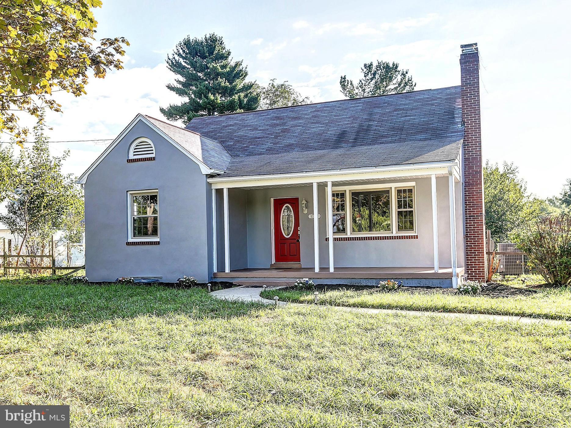 3023 Ridge Road Baltimore, MD 21244 - Photo 1 of 30 a front view of a house with garden