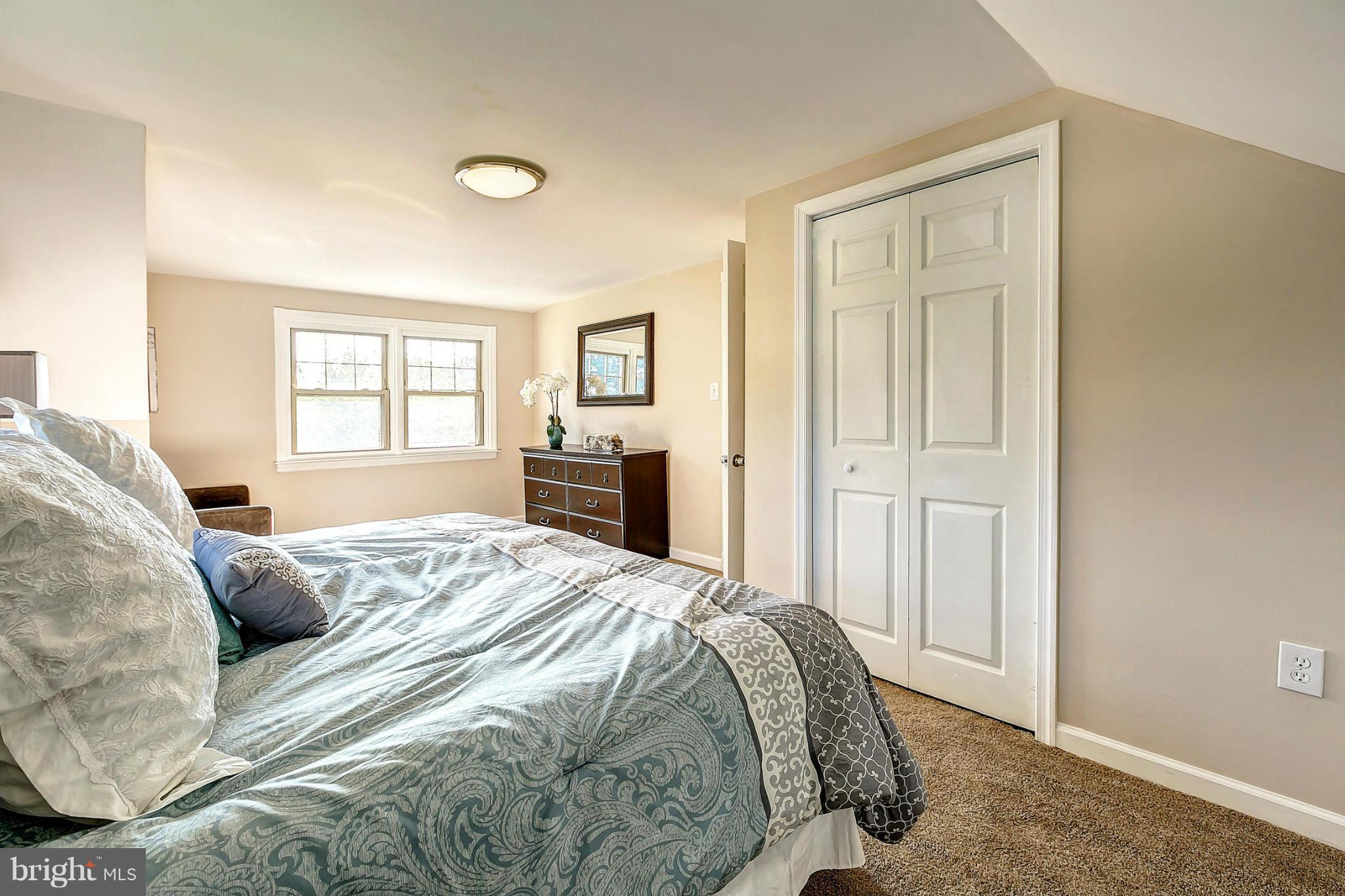 3023 Ridge Road Baltimore, MD 21244 - Photo 14 of 30 a bedroom with a bed and a window