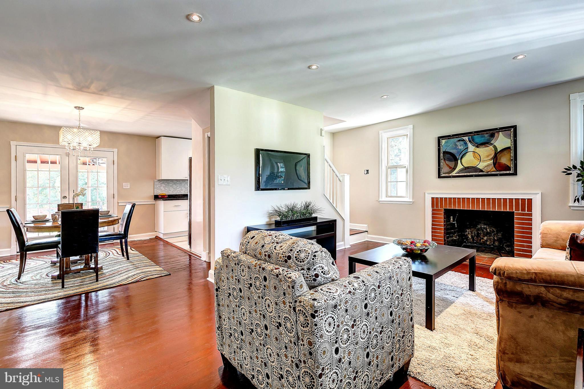 3023 Ridge Road Baltimore, MD 21244 - Photo 30 of 30 a living room with furniture a fireplace and a flat screen tv