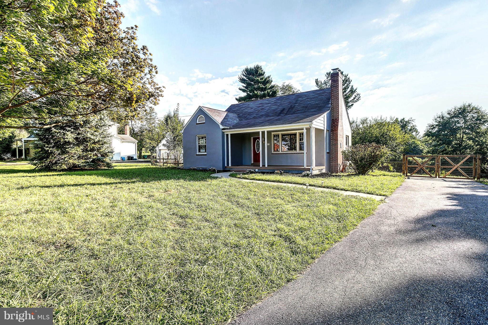 3023 Ridge Road Baltimore, MD 21244 - Photo 24 of 30 a front view of a house with a yard