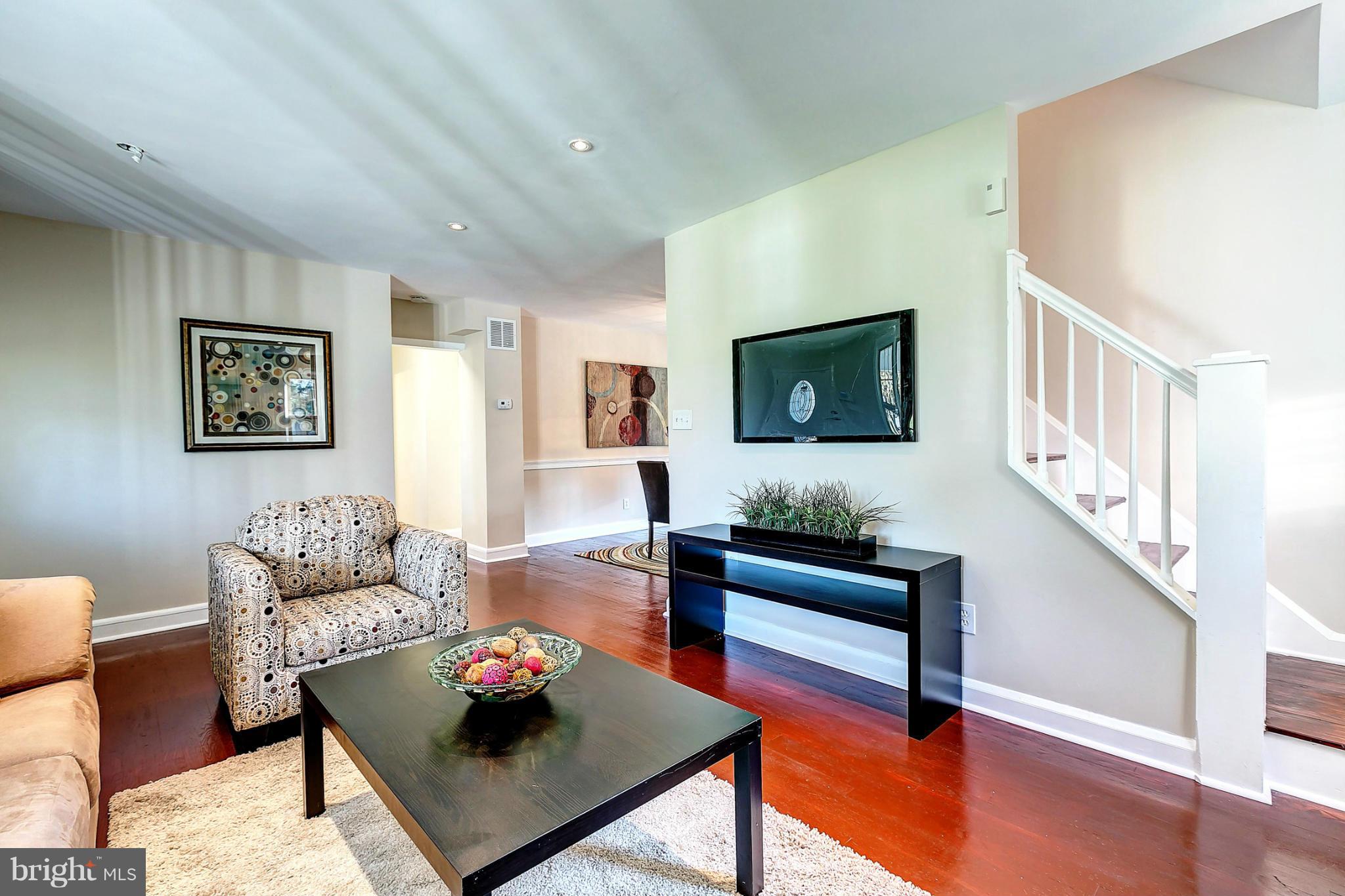 3023 Ridge Road Baltimore, MD 21244 - Photo 5 of 30 a living room with furniture and a wooden floor