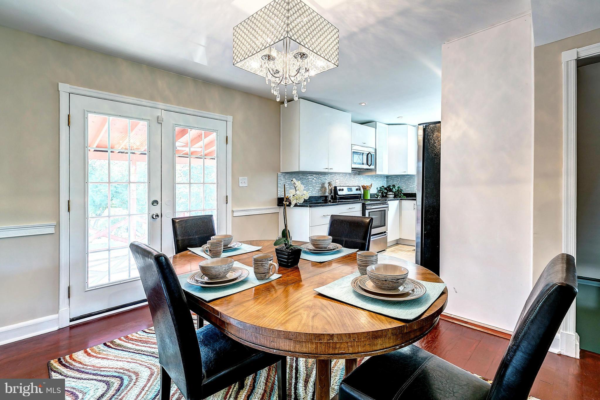 3023 Ridge Road Baltimore, MD 21244 - Photo 7 of 30 a view of a dining room with furniture window and wooden floor