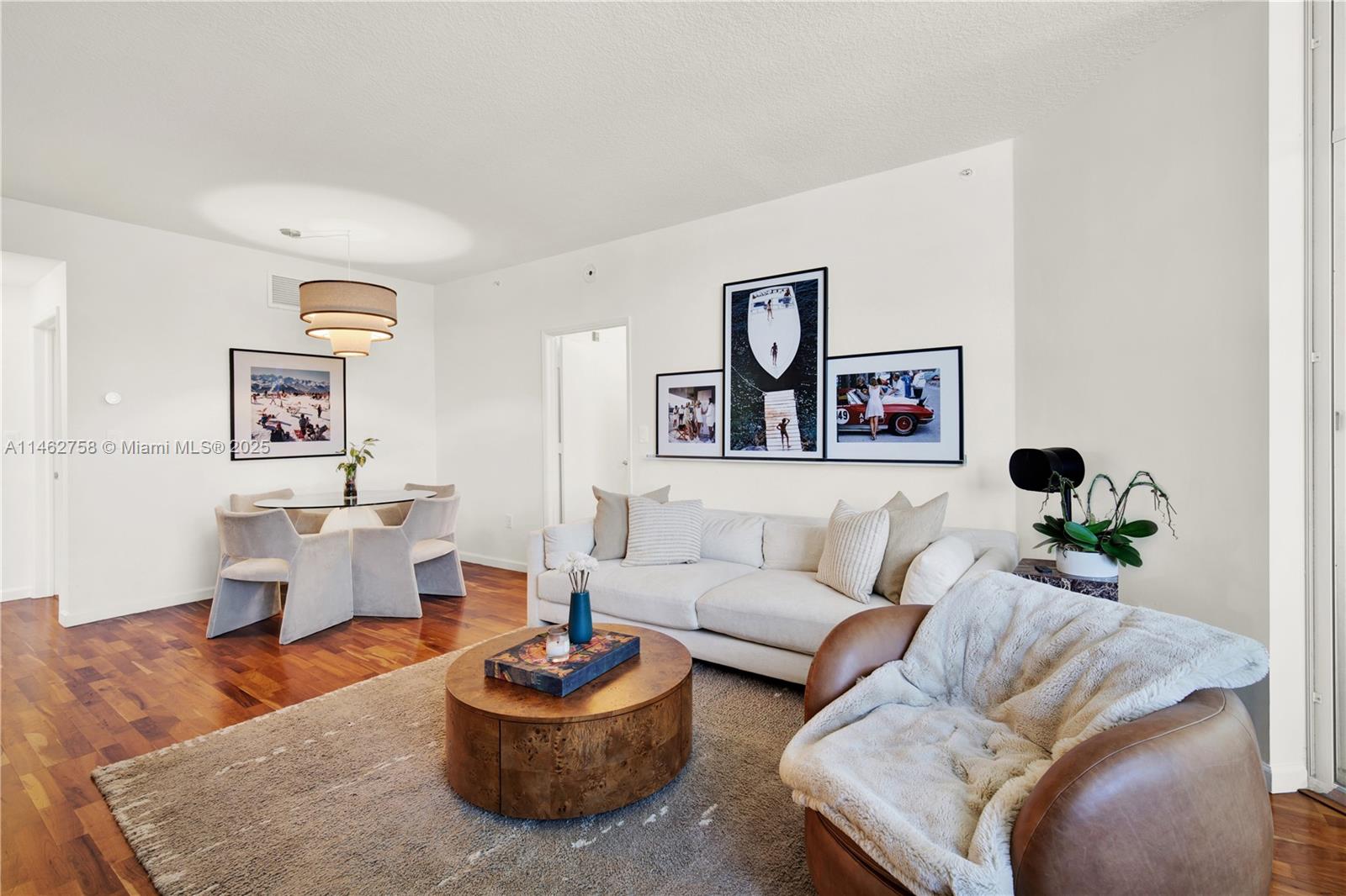 1 Century Lane, Unit 209 Miami Beach, FL 33139 - Photo 19 of 66 a living room with furniture and a wooden floor
