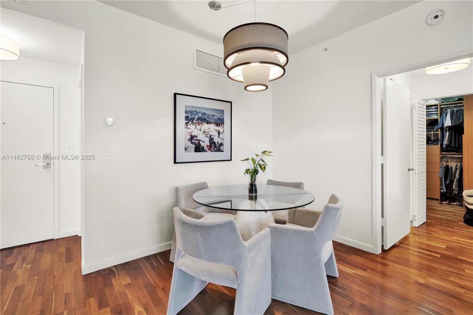1 Century Lane, Unit 209 Miami Beach, FL 33139 - Photo 20 of 66 a dining room with furniture and wooden floor