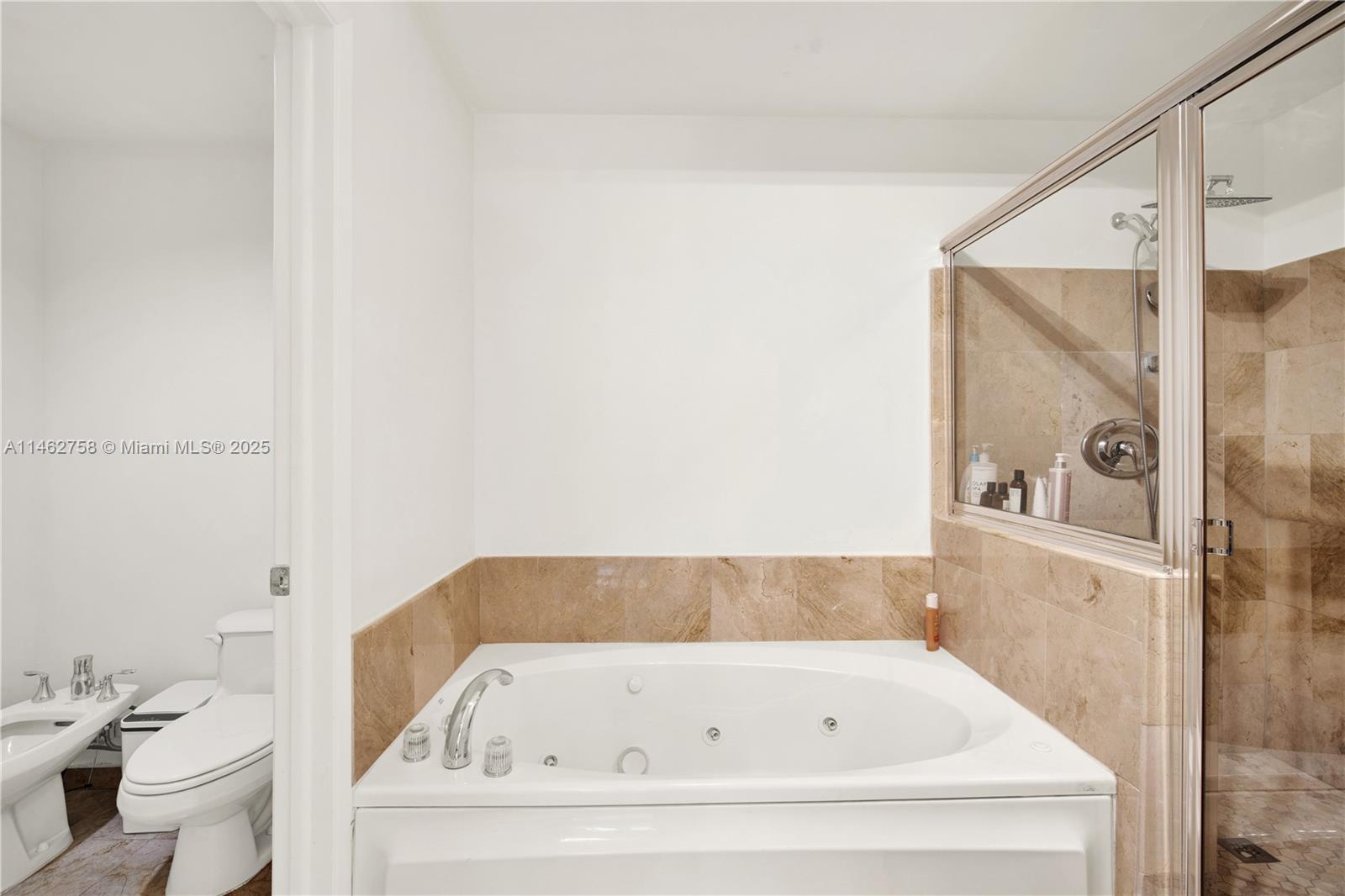 1 Century Lane, Unit 209 Miami Beach, FL 33139 - Photo 32 of 66 a bathroom with a bathtub and a toilet