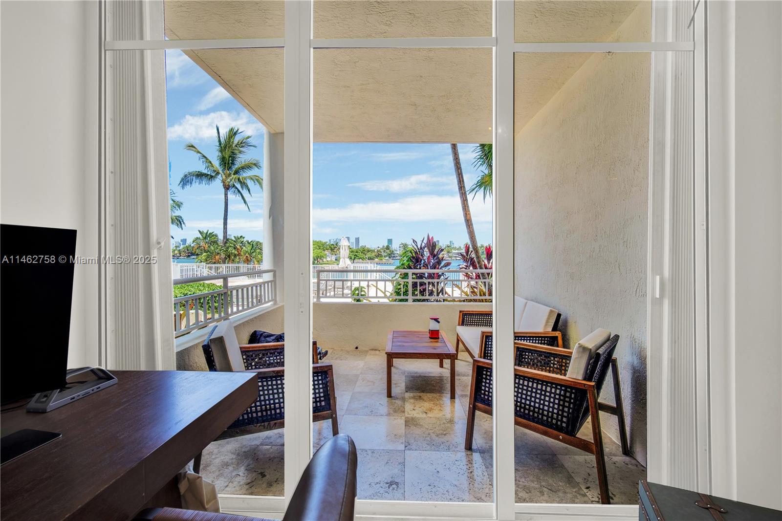 1 Century Lane, Unit 209 Miami Beach, FL 33139 - Photo 40 of 66 a workspace with furniture and a window