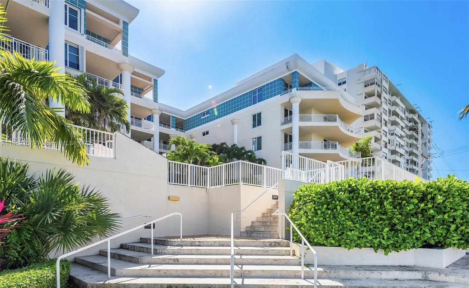 1 Century Lane, Unit 209 Miami Beach, FL 33139 - Photo 5 of 66 a view of building with yard and staircase