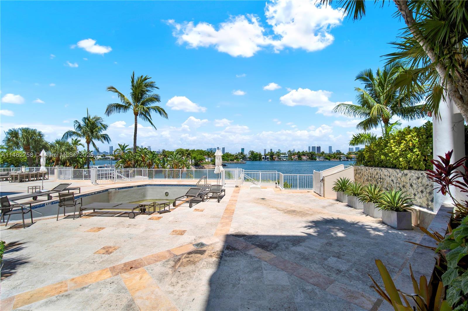 1 Century Lane, Unit 209 Miami Beach, FL 33139 - Photo 62 of 66 a view of swimming pool with outdoor seating and plants