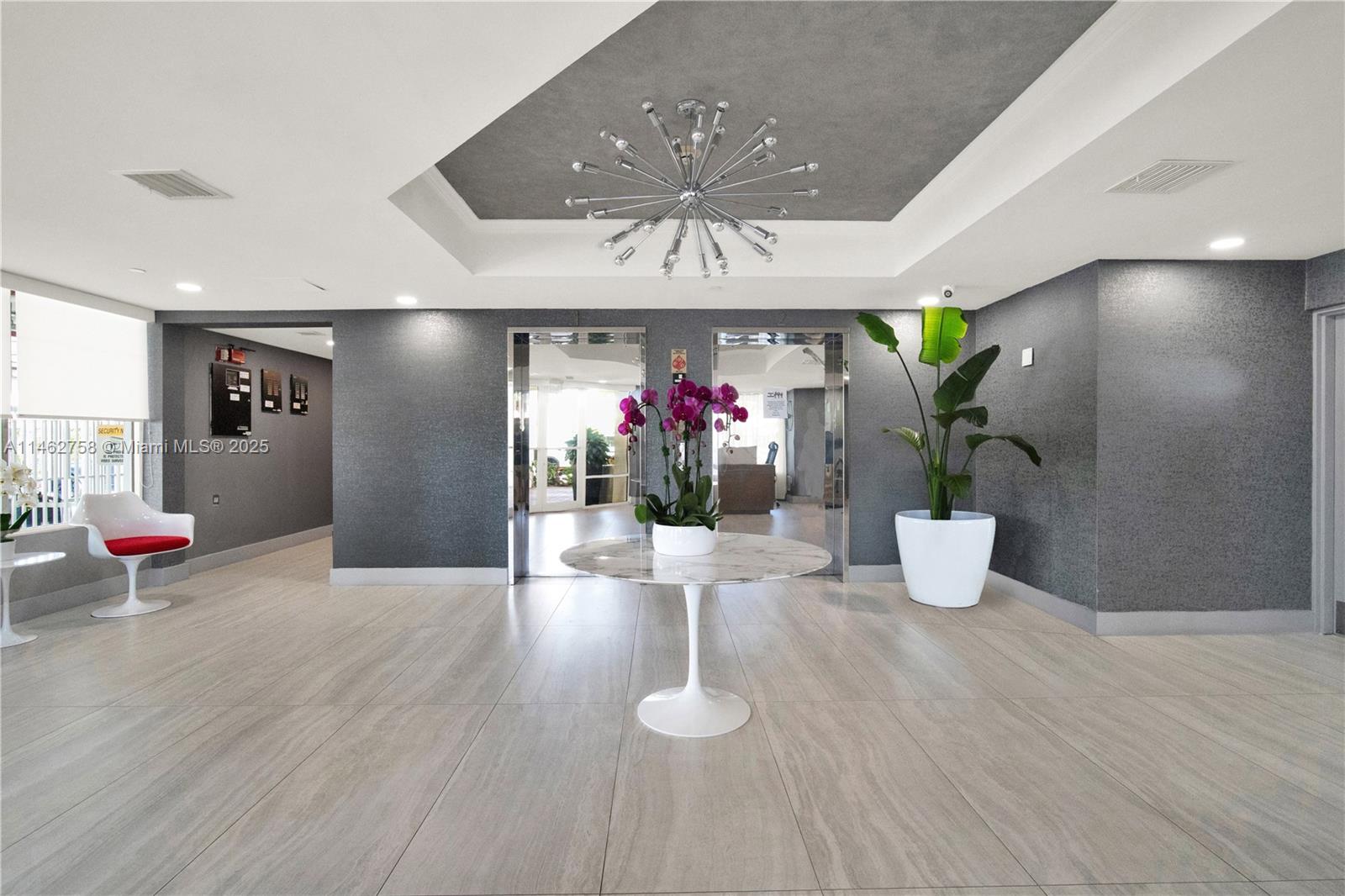 1 Century Lane, Unit 209 Miami Beach, FL 33139 - Photo 7 of 66 a view of a dining room with furniture and wooden floor