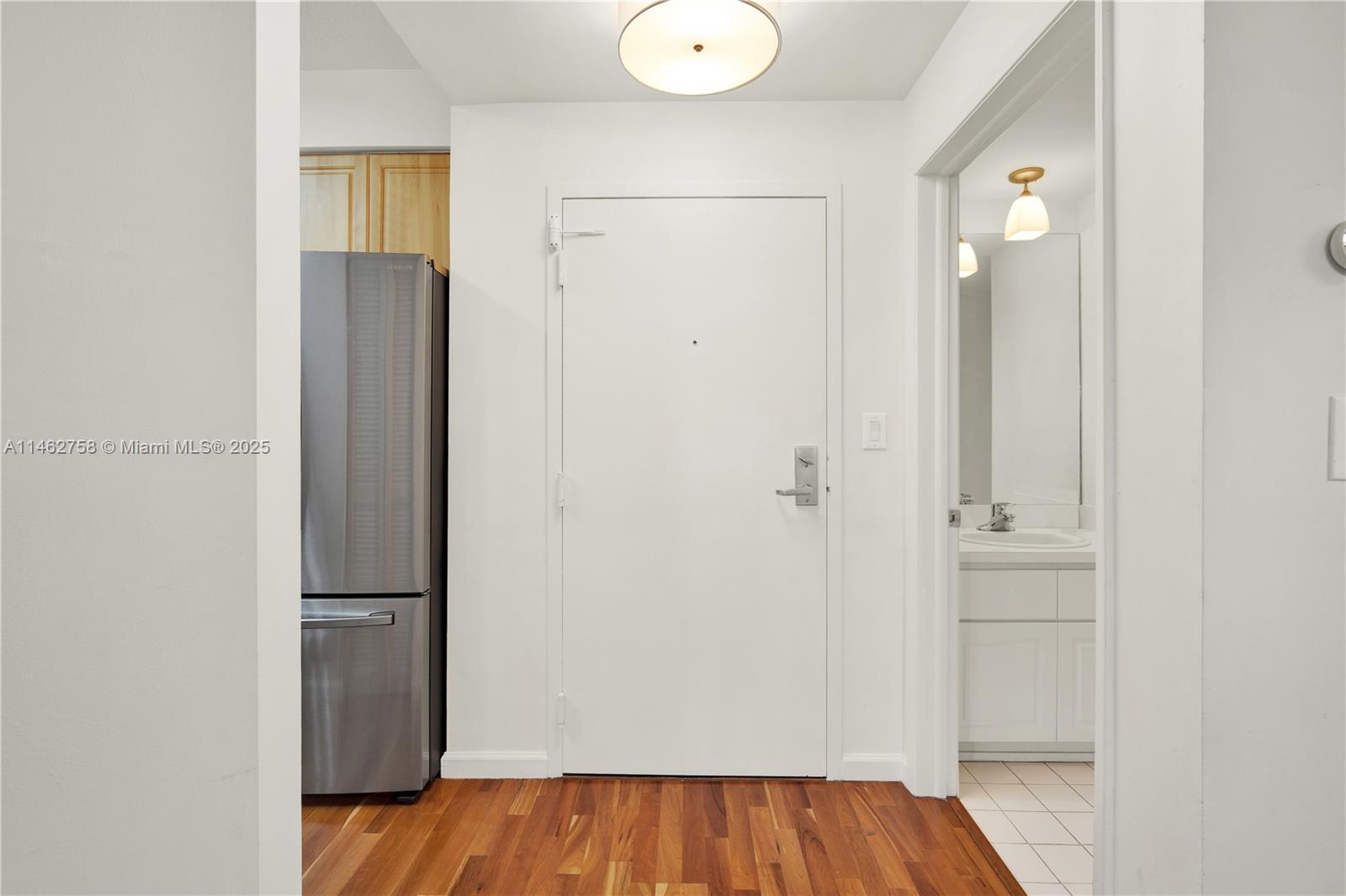 1 Century Lane, Unit 209 Miami Beach, FL 33139 - Photo 9 of 66 a view of bathroom with a sink and a mirror
