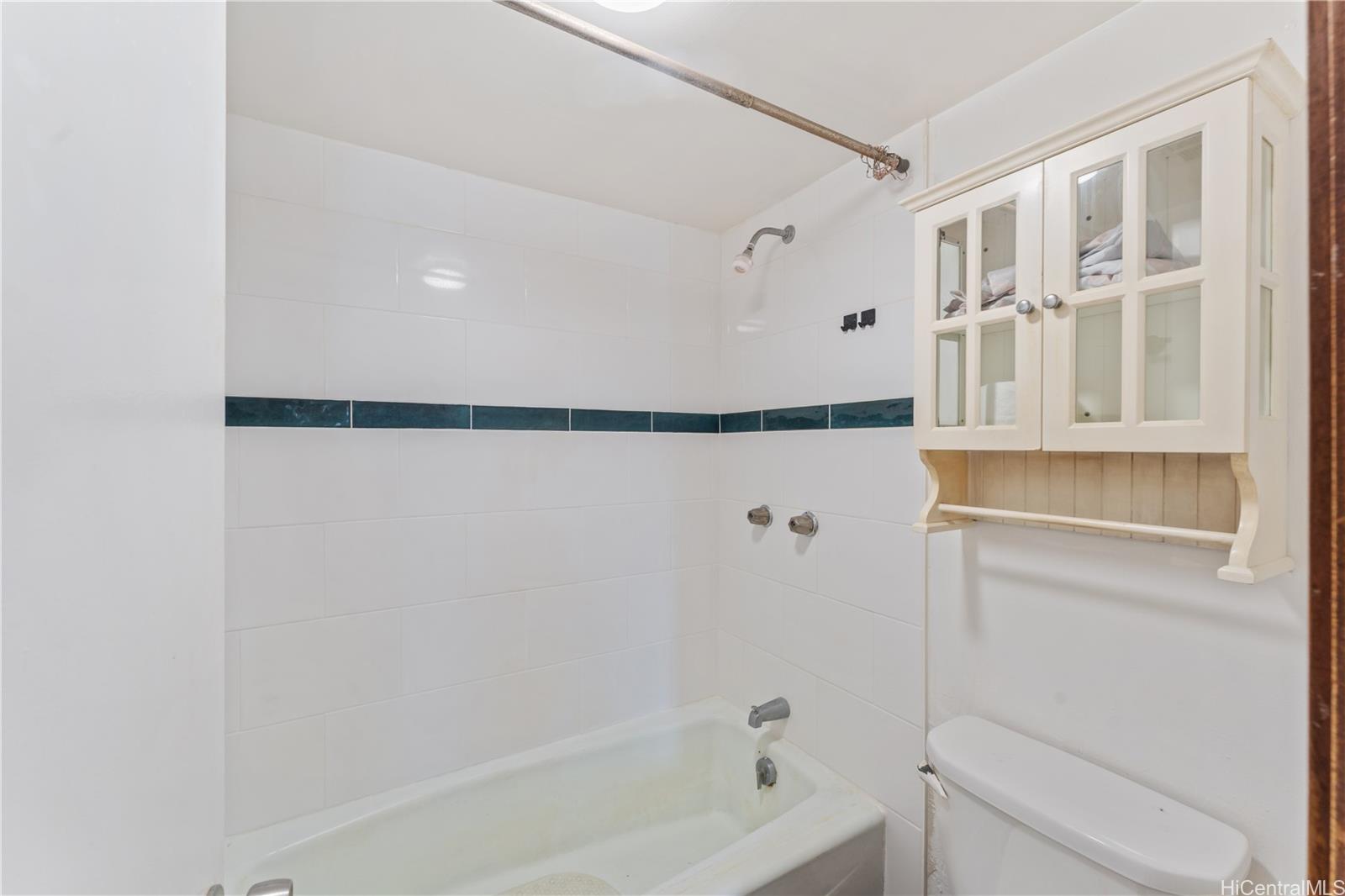 1505 Alexander Street, Unit 1205 Honolulu, HI 96822 - Photo 12 of 25 a bathroom with a bathtub and a shower